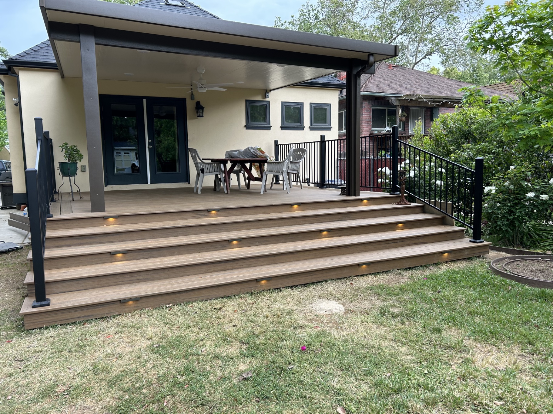 Covered composite deck with lighted steps built in Sacramento
